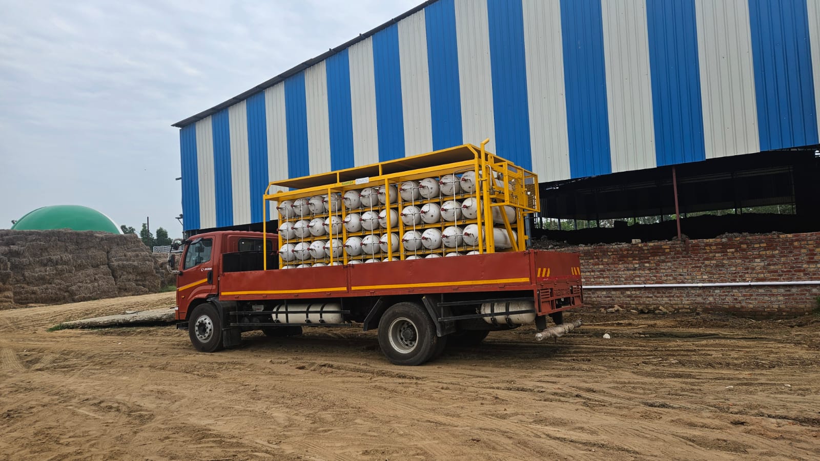 Cascade truck loaded with Compressed Bio-Gas cylinders prepared for dispatch