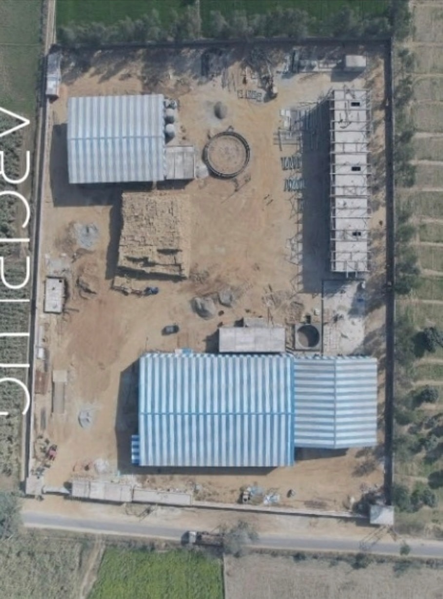 Plan view drone photograph of the Radha Raman CBG facility layout at Dhansri, Jansath
